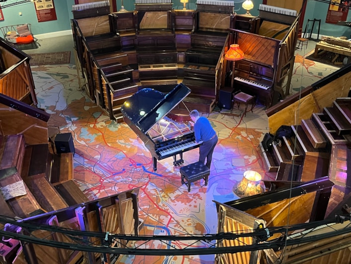 Pianodrome at Leeds City Museum: Expert piano tuner John Tordoff at Leeds City Museum, ensuring the Pianodrome is on song ahead of the concert this Sunday.
The museum and Pianodrome itself will host Duo Ardašev - a piano duo comprising pianists Renata Lichnovská and Igor Ardašev.