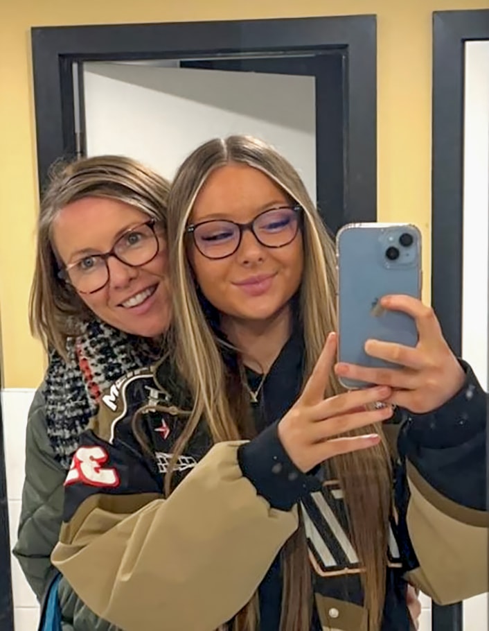Baton of Hope 1: Picture shows Bairbre and her daughter taking a selfie in a mirror with Robyn's phone, both smiling at the camera
