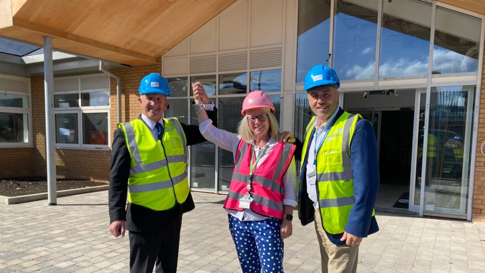 Cllr Steve Clark, headteacher Marie Hunter and Cllr Wayne Little at the entry to the new school site