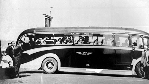 Vehicle with passengers in the late 1950s