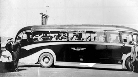 Vehicle with passengers in the late 1950s