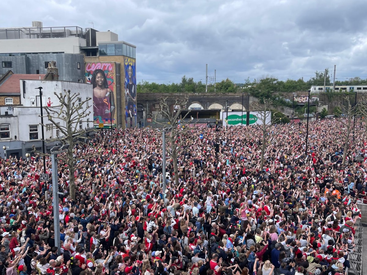 Fans watch on as Arsenal celebrate their success in the Women's Champions League