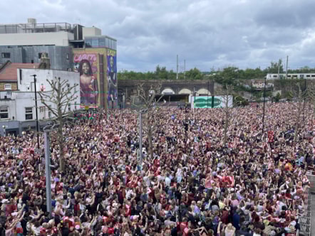 Fans watch on as Arsenal celebrate their success in the Women's Champions League