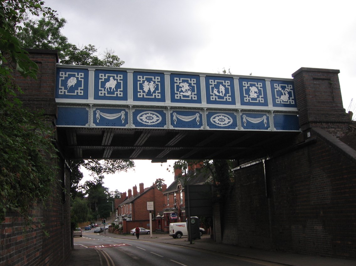 Zodiac bridges_2: Two parallel bridges over Brook Road, Stourbridge, decorated with signs of the zodiac and cut glass motifs.