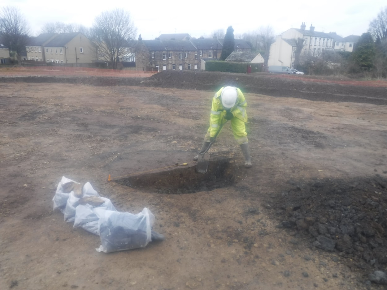 Pitty Close Farm finds: Archaeologists excavate the site at Pitty Close Farm in Leeds.
As well as the cremated remains of a child and three adults, the dig uncovered fragments of a decorated clay urn, part of a pin which was carefully carved from a piece of animal bone and the shattered blade of a delicately honed flint knife.
Photo credit WYAAS.
