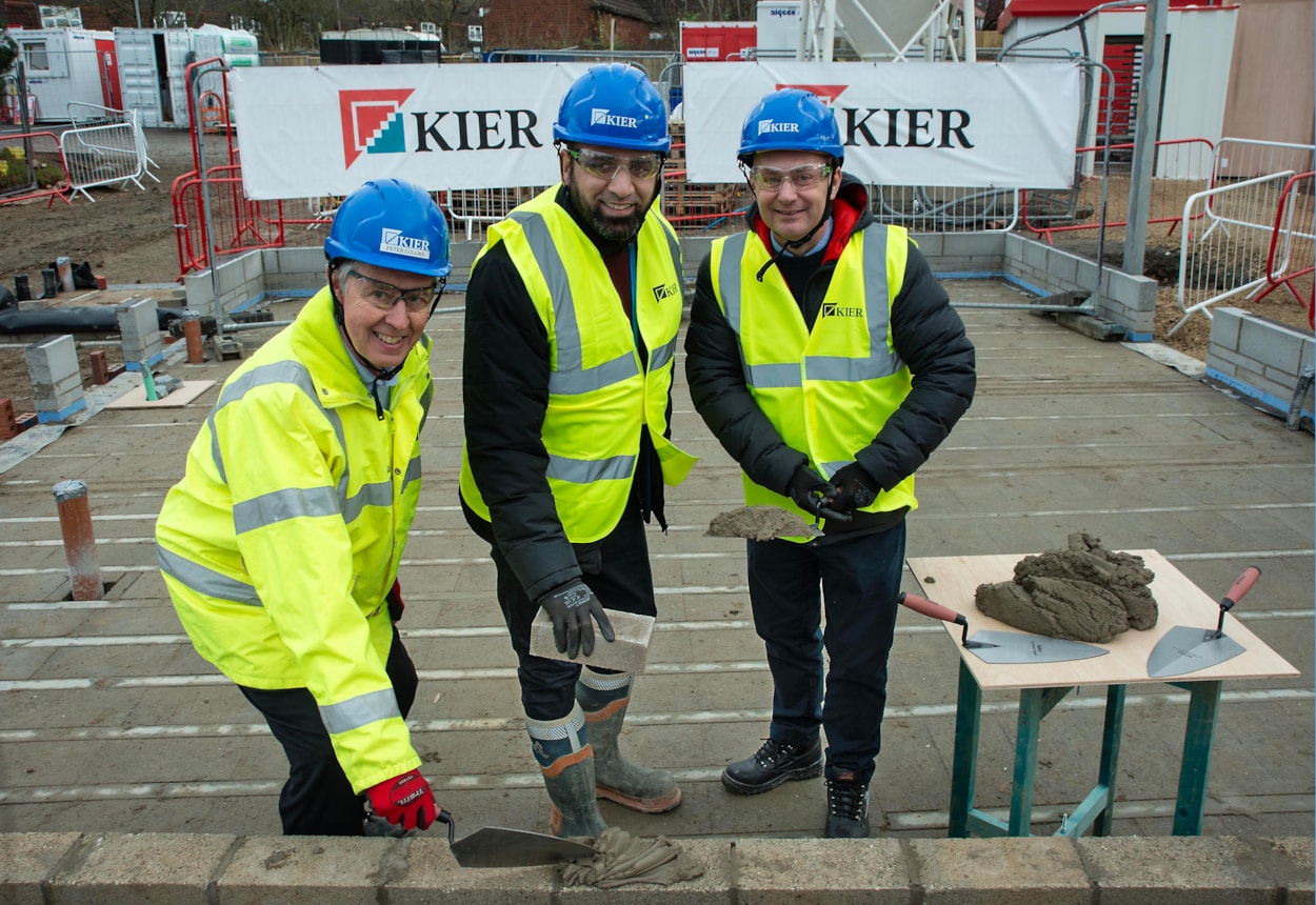 Yeadon care home: Building work begins a pioneering new Leeds residential care home. Pictured, from left: Peter Collins, contracts manager for Kier Construction North & Scotland, Kashif Ahmed, deputy director of integrated commissioning - adults and health at Leeds City Council and Eddie Devine, programme director (mental health, learning disability, neurodiversity) at the Leeds office of NHS West Yorkshire ICB. Picture credit: Beccy Lane