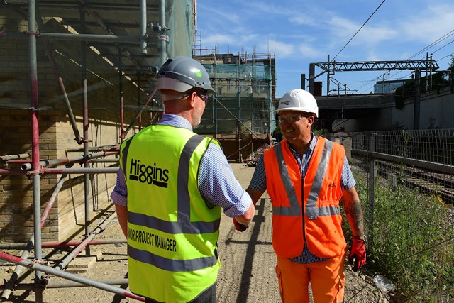 Engineers shaking hands - Higgins Chobham Farm