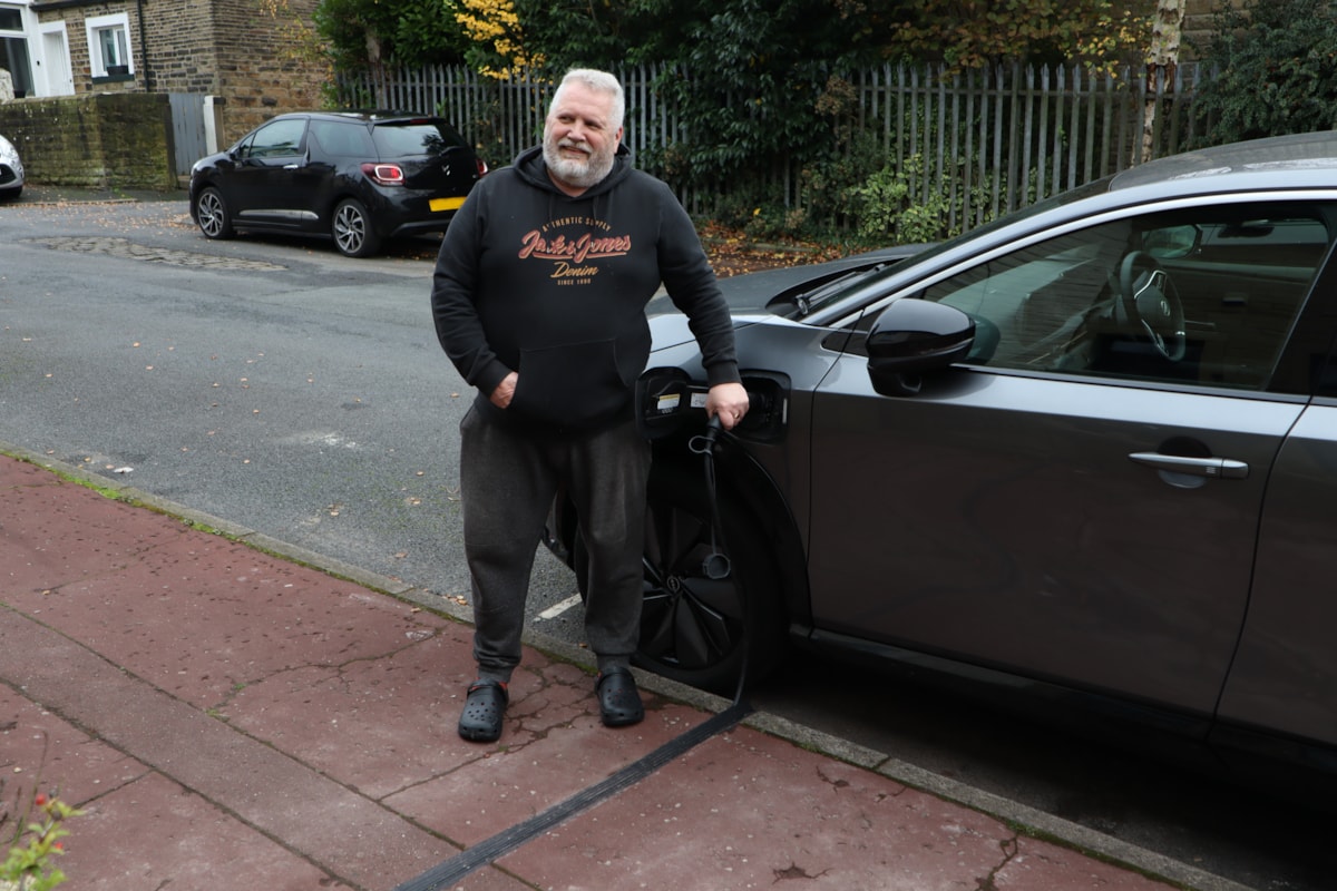 Mike Pickering with his new electric vehicle cross-pavement channel