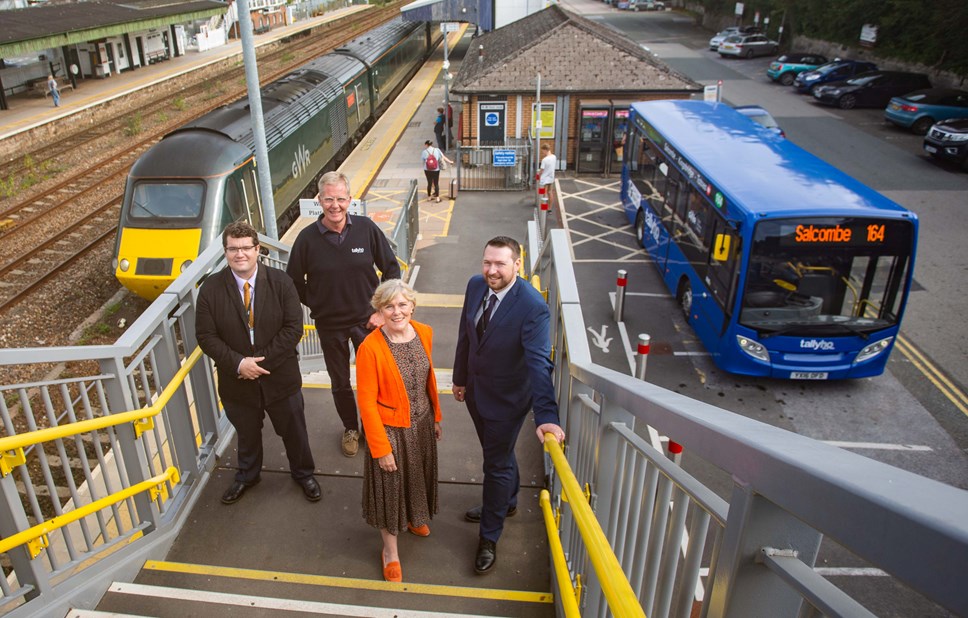 Pictured at Totnes station between a GWR Castle Class train and the new 164 service bus are, left to right, GWR Regional Development Manager Luke Farley, Tally Ho Managing Director Don McIntosh, Devon County Councillor Andrea Davis and GWR Regional Growth Manager David Whiteway