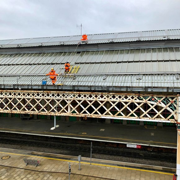 Engineers inspecting roof at Preston station after Storm Eunice