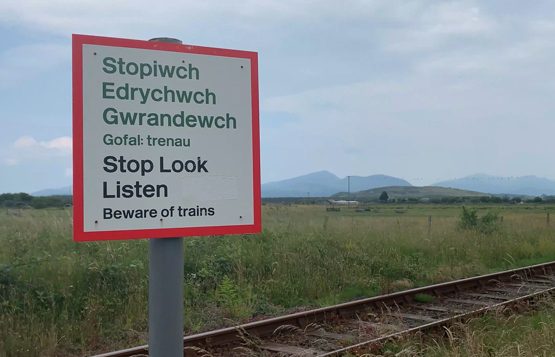 Level crossing users given safety reminder as new timetable changes rail services in some parts of Wales and the Borders: SLL sign Harlech level crossing
