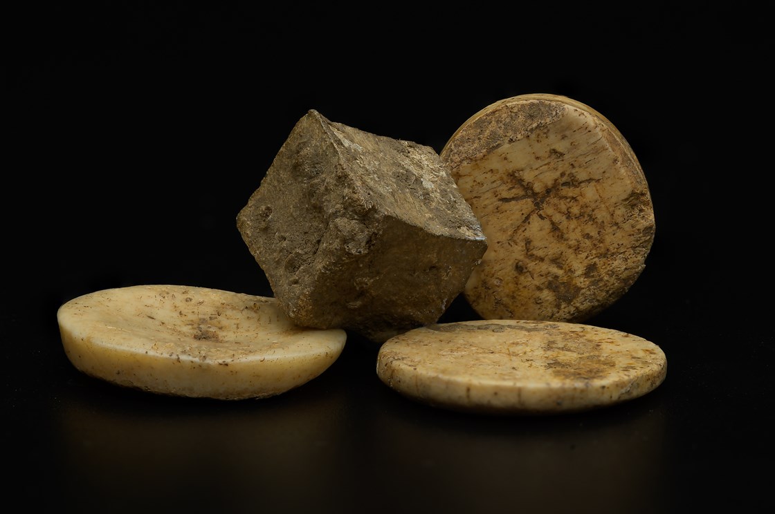 Roman (lead) die (bone) gaming pieced uncovered during the archaeology excavation at Blackgrounds, Chipping Warden, Northamptonshire