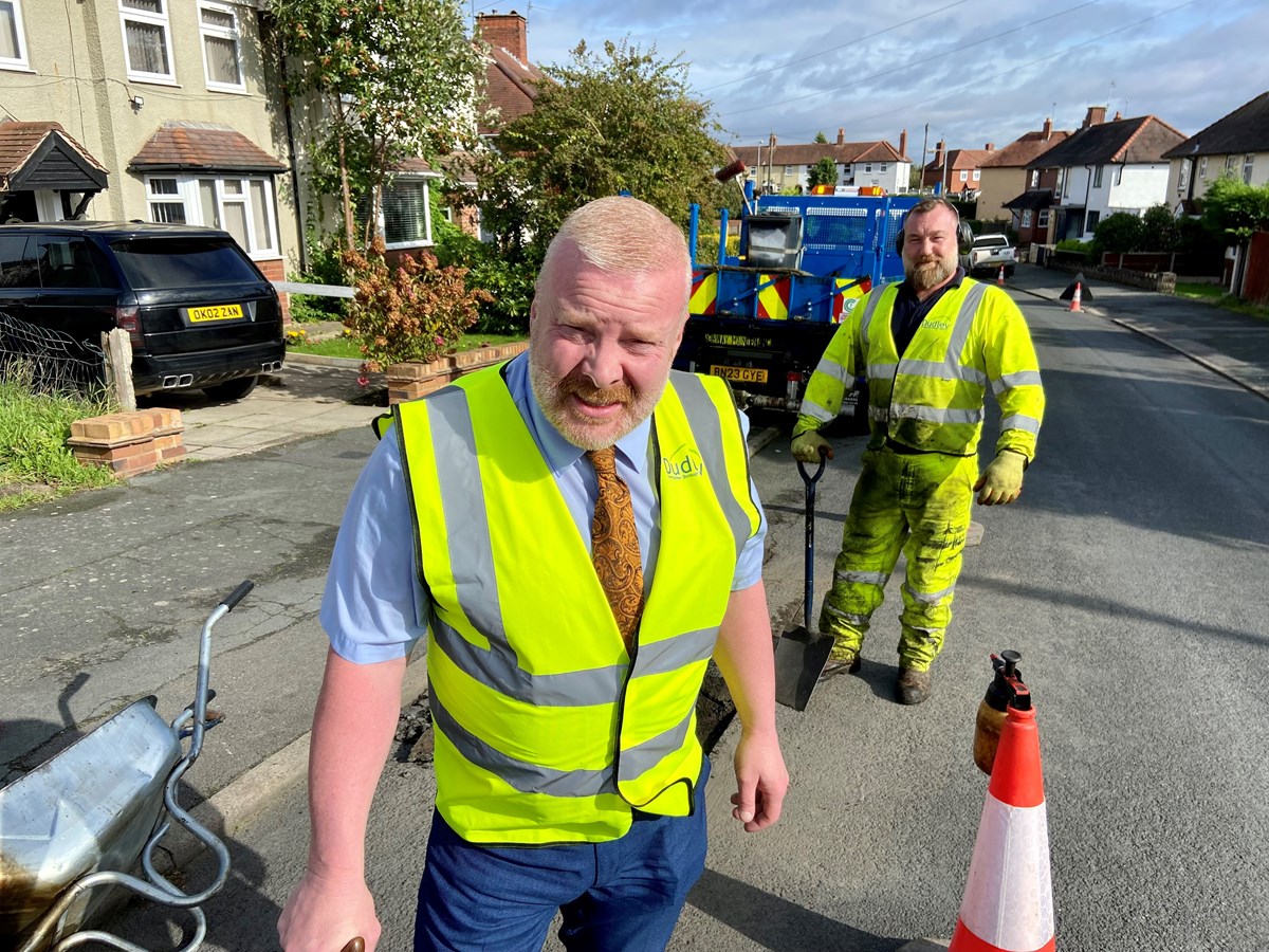 Cllr Damian Corfield, cabinet member for highways and environmental services, with Craig Reid, highways operative, repairing a pothole in Lady Greys walk, Stourbridge