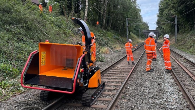 Network Rail engineers clearing vegetation on the Cross City line cropped: Network Rail engineers clearing vegetation on the Cross City line cropped