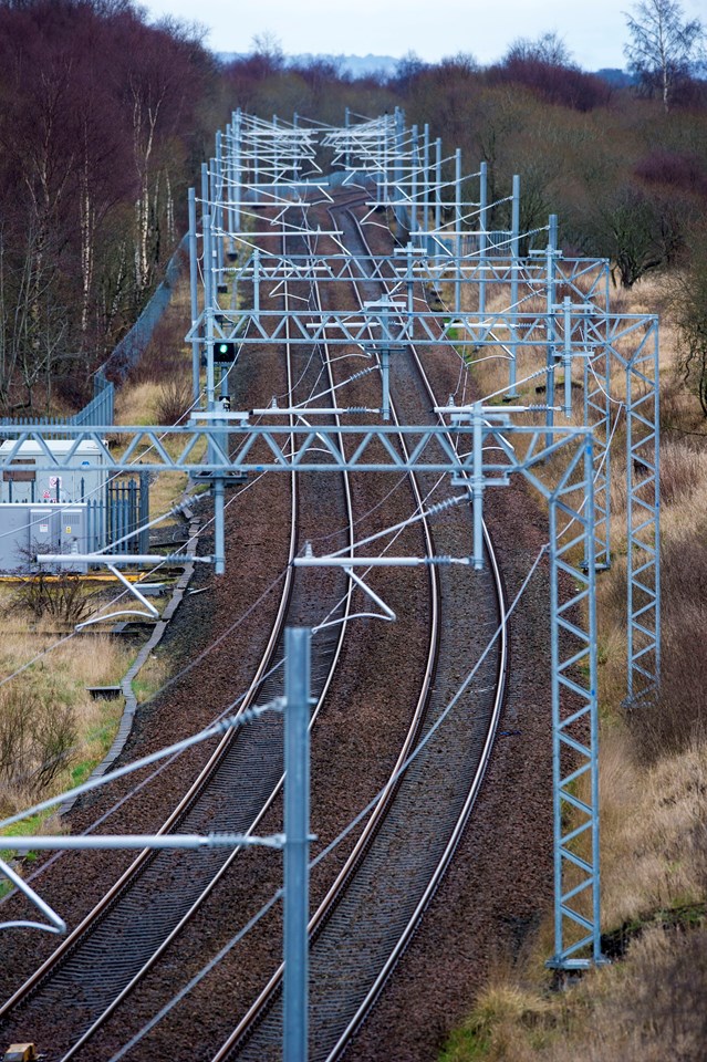 Edinburgh-Glasgow electrification work set to begin: Cumbernauld line - new ovehead power line stanchions