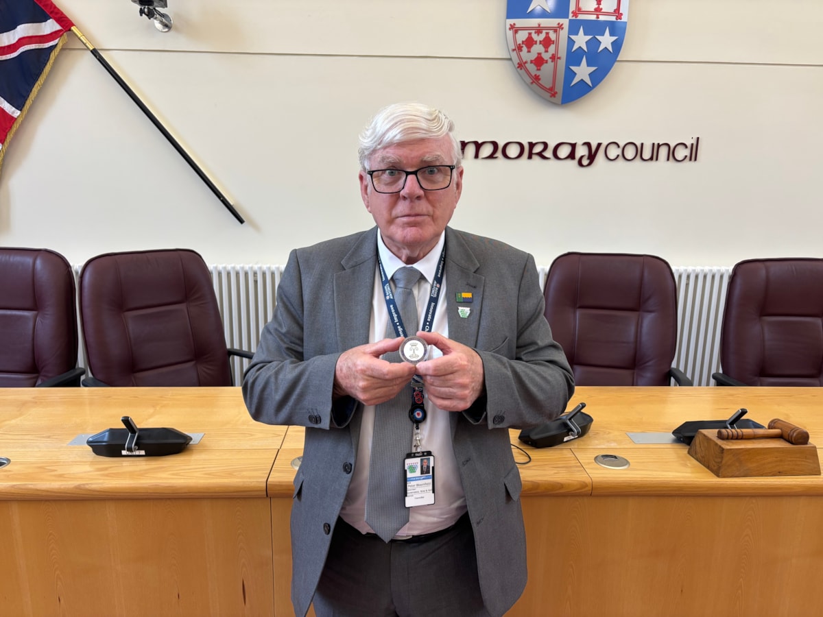 Cllr Bloomfield with award