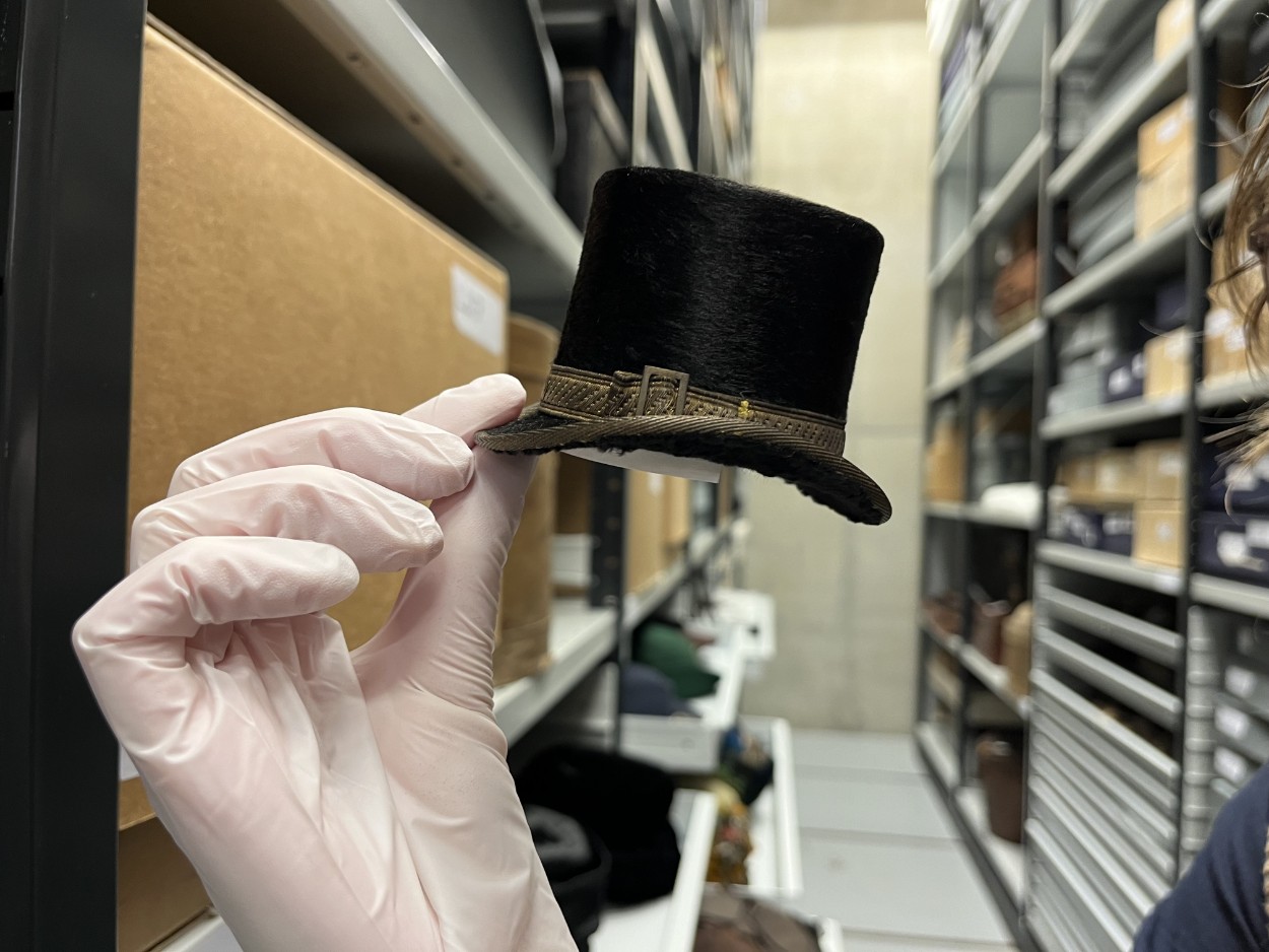 Leeds Discovery Centre hats: A tiny top hat, one of a remarkable range of tiny replica hats, some of which fit in the palm of a hand. They were made by Leeds hatter John Craig in the early 1900s and is being carefully conserved as part of a project at the Leeds Discovery Centre.