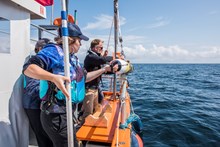 The team at Woods Hole Oceanographic Institution (WHOI), prepare to deploy their underwater robot camera © Jane Morgan  WWF UK