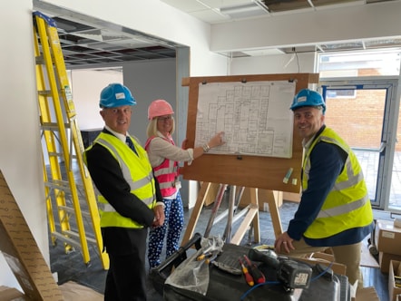 Cllr Steve Clark, headteacher Marie Hunter and Cllr Wayne Little take a look at latest plans