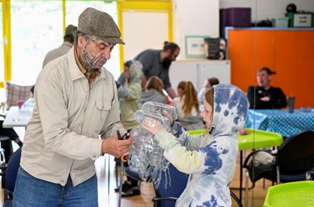 Artist George Nuku working with young people from the Pilton Youth and Children's Project and Granton Youth on components for the artwork Bottled Ocean 2123, an imagined underwater landscape made from recycled plastic. The work will go on show in the exhibition Rising Tide: Art and Environment in Oceania, which opens on August 12 at the National Museum of Scotland. Image credit: Neil Hanna.