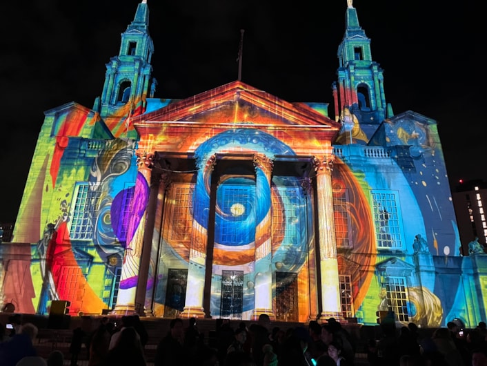 Light Night 2025: At Leeds Civic Hall a remarkable new commission by Portuguese artists Ocubo, co-produced by the British Library, was projected across the building’s façade.
Entitled, Portals: The Machine of Worlds, the piece uses fantastical imagery from books in the library’s collection, exploring universes of science, illusion and discovery.