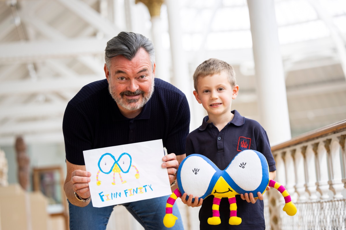 Grant Stott presents seven-year-old William Lunsden with his winning 'Mathscot' design at the National Museum of Scotland. Photo (c) Duncan McGlynn (1)