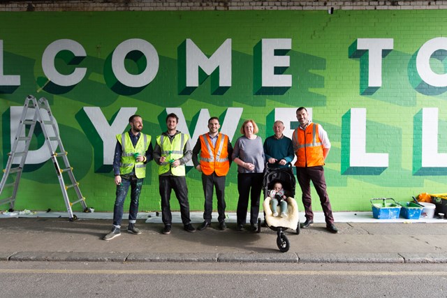 Railway bridge mural brightens up Ladywell: Network Rail staff, Bread Collective artists and local residents pose for a picture at the new mural at Ellerdale Street, Ladywell