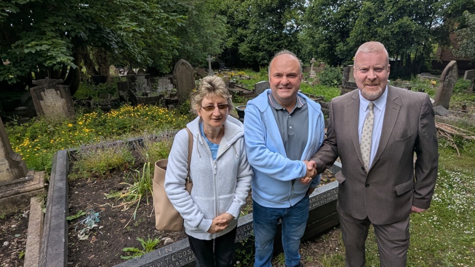Cllr Damian Corfield at All Saints Graveyard with Paul & Diane Rhodes of the Friends group