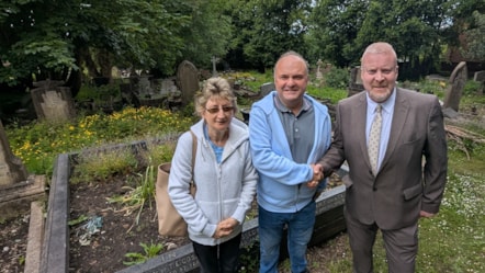 Cllr Damian Corfield at All Saints Graveyard with Paul & Diane Rhodes of the Friends group