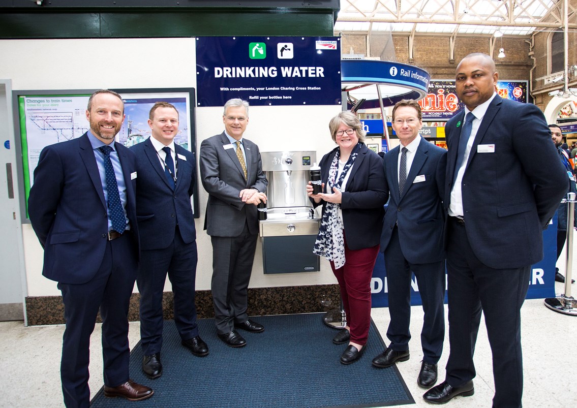 Water fountain at Charing Cross: First water fountain user at London Charing Cross. Picture centre are Network Rail's chief executive  Mark Carne and Thérèse Coffey MP, Parliamentary Under Secretary of State at DEFRA. Then L to R: South East route head of stations Ian Hanson, station manager Robert Williamson, Network Rail property director David Biggs, and assistant station manager Emmanuel Omotayo
