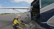 Brian boards the plane after preparing for his jump: Brian boards the plane after preparing for his jump
