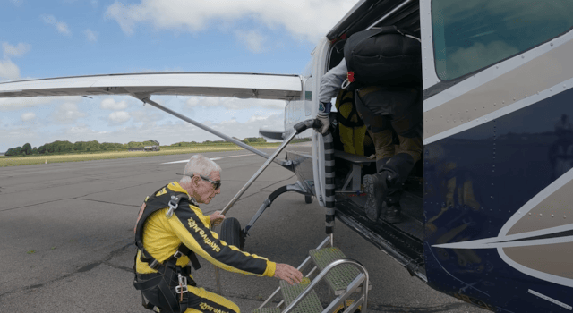 Brian boards the plane after preparing for his jump