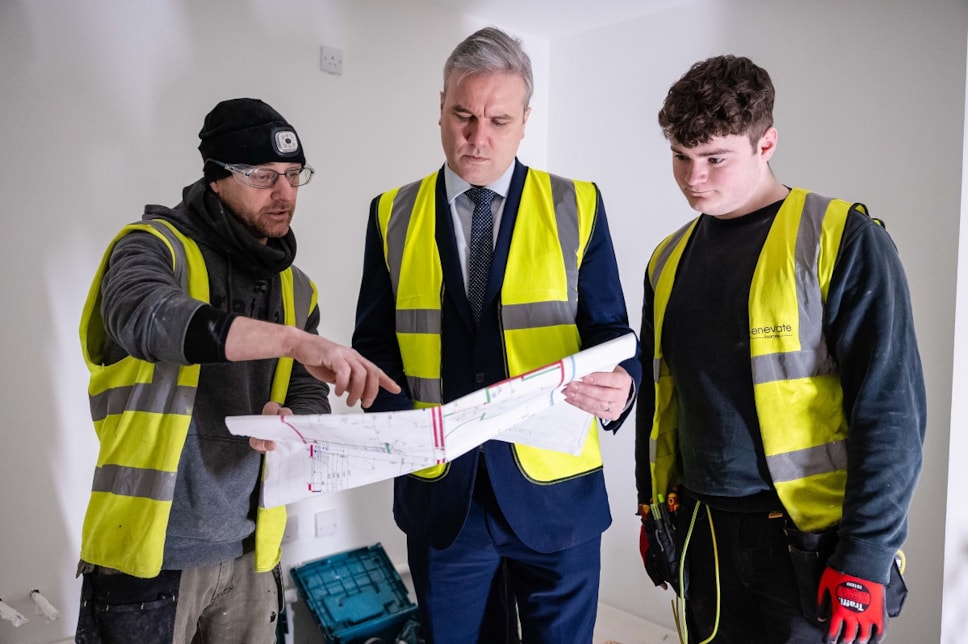 Employment and Investment Minister Tom Arthur with James Hamilton and Dylan Harker of Enevate Homes