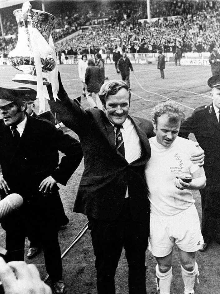 Don Revie and Billy Bremner 1972. Image: © Varley Picture Agency: Don Revie manager of Leeds United holding aloft the FA Cup in 1972 after the team beat rivals Arsenal 1-0 in the cup final. He is embracing the captain, Billy Bremner. Image: © Varley Picture Agency.