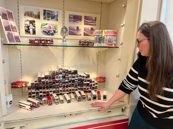 Bus collection: Assistant community curator Sapphia Cunningham-Tate alongside the new display at Leeds City Museum which gives visitors a chance to see a selection of the vast array of replicas created by physicist Dr Gordon Brooke.
The meticulously detailed models each relate to a specific real-life equivalent, complete with service number and with every painstaking detail reproduced using card, packaging and acetate for the windows.