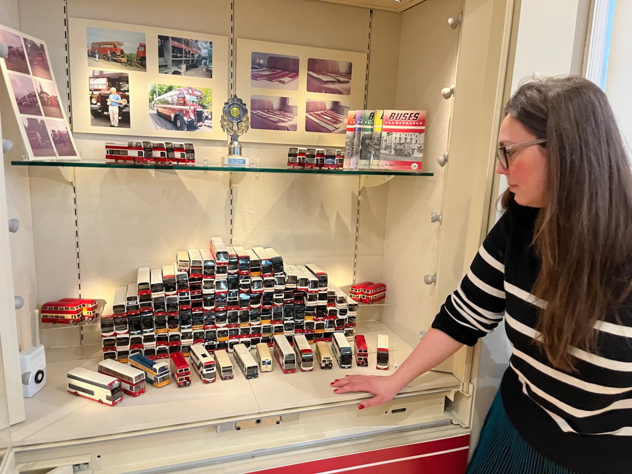 Bus collection: Assistant community curator Sapphia Cunningham-Tate alongside the new display at Leeds City Museum which gives visitors a chance to see a selection of the vast array of replicas created by physicist Dr Gordon Brooke.
The meticulously detailed models each relate to a specific real-life equivalent, complete with service number and with every painstaking detail reproduced using card, packaging and acetate for the windows.