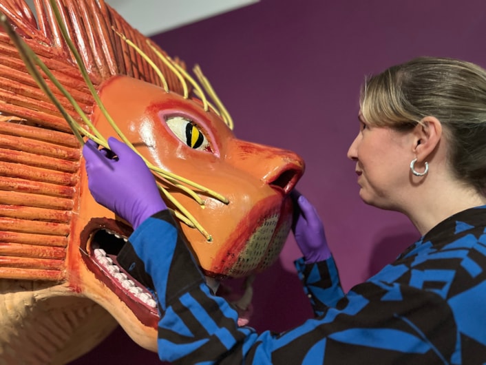 Living with Death: Kat Baxter, Leeds Museums and Galleries' curator of archaeology, with the lion coffin was made by world famous Ghanaian coffin carpenter Paa Joe.
Leeds City Museum’s Living with Death exhibition, which opens today (May 3) features a remarkable array of objects spanning thousands of years of world history and tradition which all explore how different cultures experience death, dying, and bereavement.