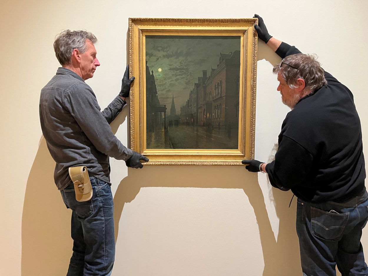 Grimshaw at LAG: Technicians at Leeds Art Gallery hang John Atkinson Grimshaw's famous depiction of Park Row in Leeds, one of the works on display as part of Don’t Let’s Ask For the Moon: Nocturnes and Atkinson Grimshaw, which opens at Leeds Art Gallery this November 14.