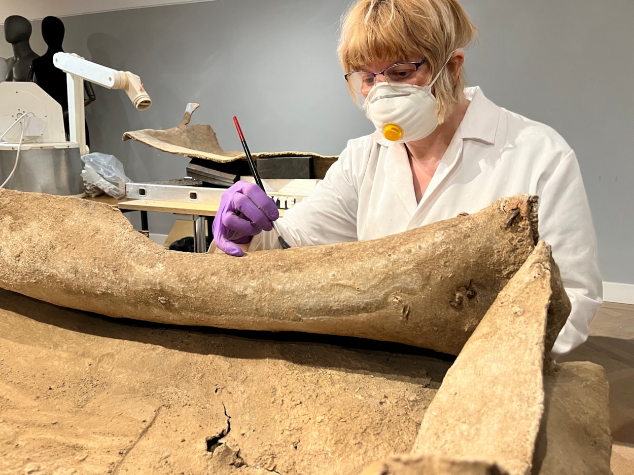 Living with Death coffin display: Emma Bowron, conservator with Leeds Museums and Galleries, works on the ancient lead coffin which lay buried in a Leeds field for more than 1,600 years.
The astonishing discovery, described by experts as a once-in-a-lifetime find, was made during excavation work by West Yorkshire Archaeological Services in a previously unknown site near Garforth.
It will go on display at Leeds City Museum in May as part of a new exhibition called Living with Death.