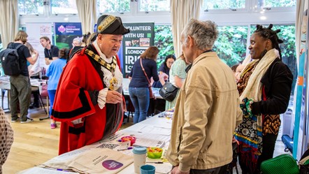 The Mayor of Islington attending a previous volunteering fair in ceremonial robes