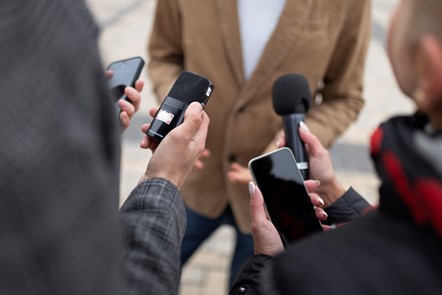 close-up-reporter-taking-interview