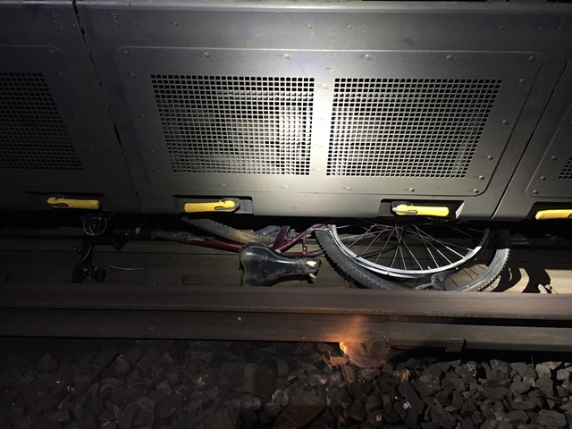 Bicycle jammed under train, Gravesend: This bicycle was dumped onto the railway at Gravesend and run over by a train