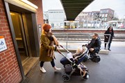 TfL Image - Mobility scooter and pushchair user at Brockley station: TfL Image - Mobility scooter and pushchair user at Brockley station