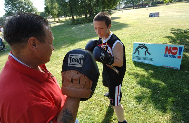 Daniel Thomas, 12 of Llanrumney, enjoys the No Messin' Live! event: Daniel Thomas, 12 of Llanrumney, Cardiff enjoys a boxing lesson with Boxing Community Coach Alan Davis at No Messin' Live! Cardiff at the Eastern Leisure Centre