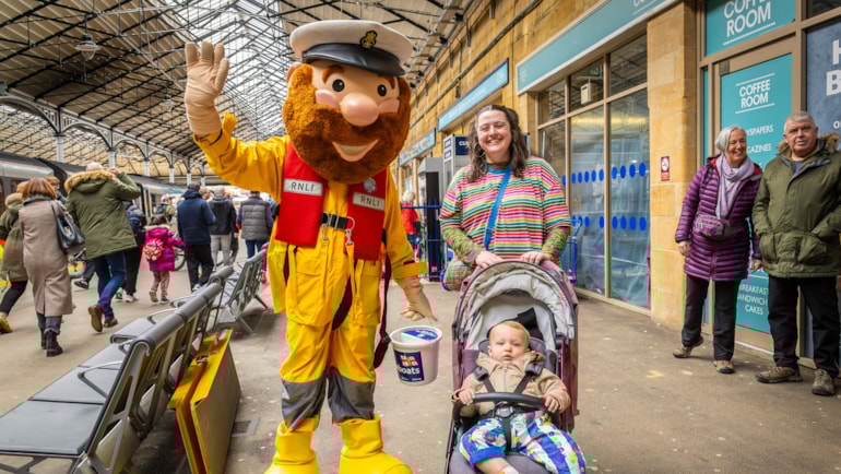 Volunteers raise funds for lifeboat charity at Scarborough station