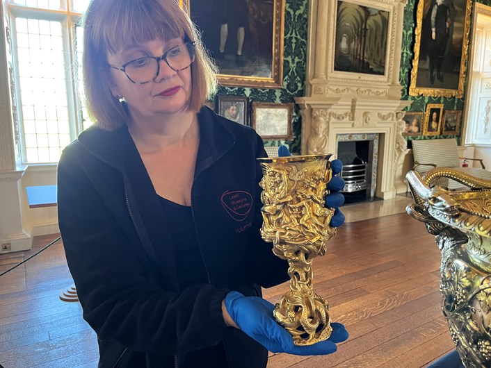 Temple Newsam treasures: Leeds Museums and Galleries conservator Emma Bowron with a silver gilt cup made by John Fig in 1842, part of an array of silverware that has been conserved for a revamped display at Temple Newsam House.