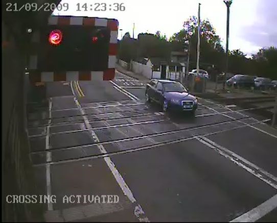 Motorist ignores warning lights at Narborough level crossing, Leicester (3): Motorist ignores warning lights at Narborough level crossing, Leicester (3)