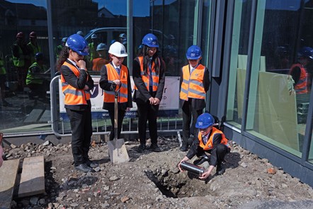 Group of Haverfordwest High pupils burying time capsule at Western Quayside