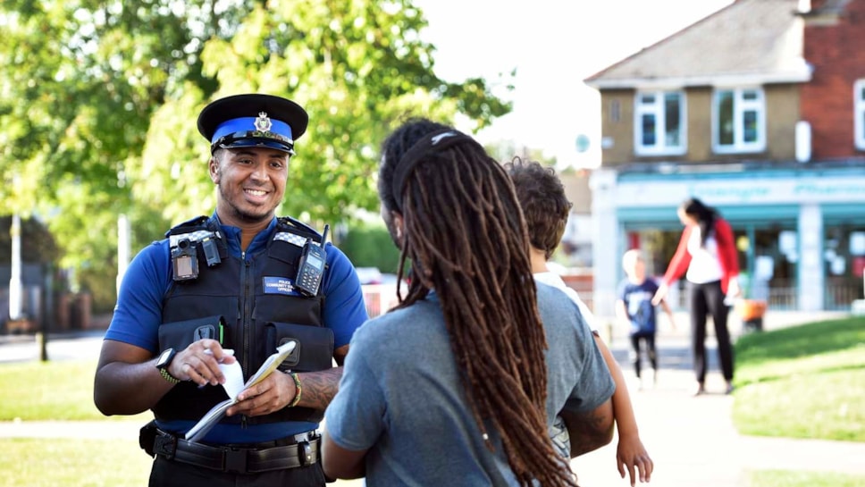 A policeman talking to a member of the public-2
