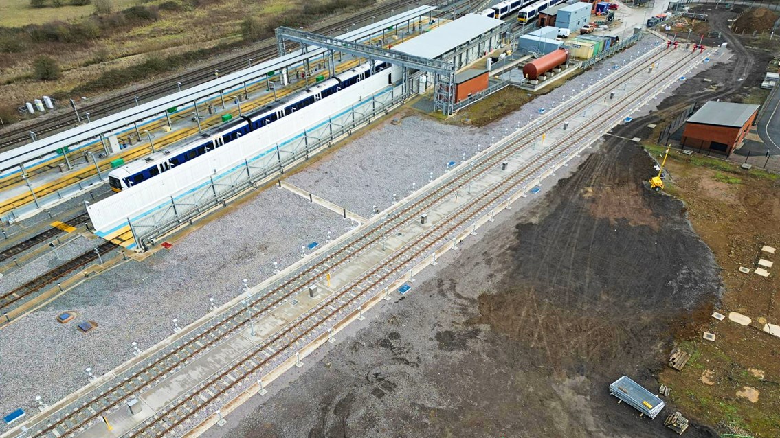 Drone shot of entire Banbury train depot with Chiltern train in background